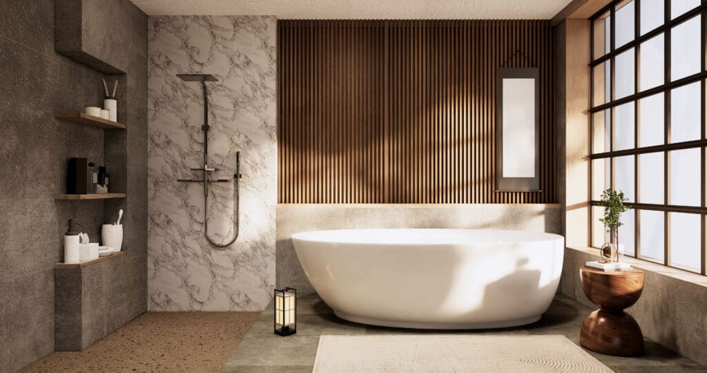 Modern bathroom with a freestanding oval bathtub, wood slat accent wall, marble shower, and open shelves. Perfect for a stylish bathroom renovation, this space features warm natural light, a large window, and a small wooden side table with plant décor.